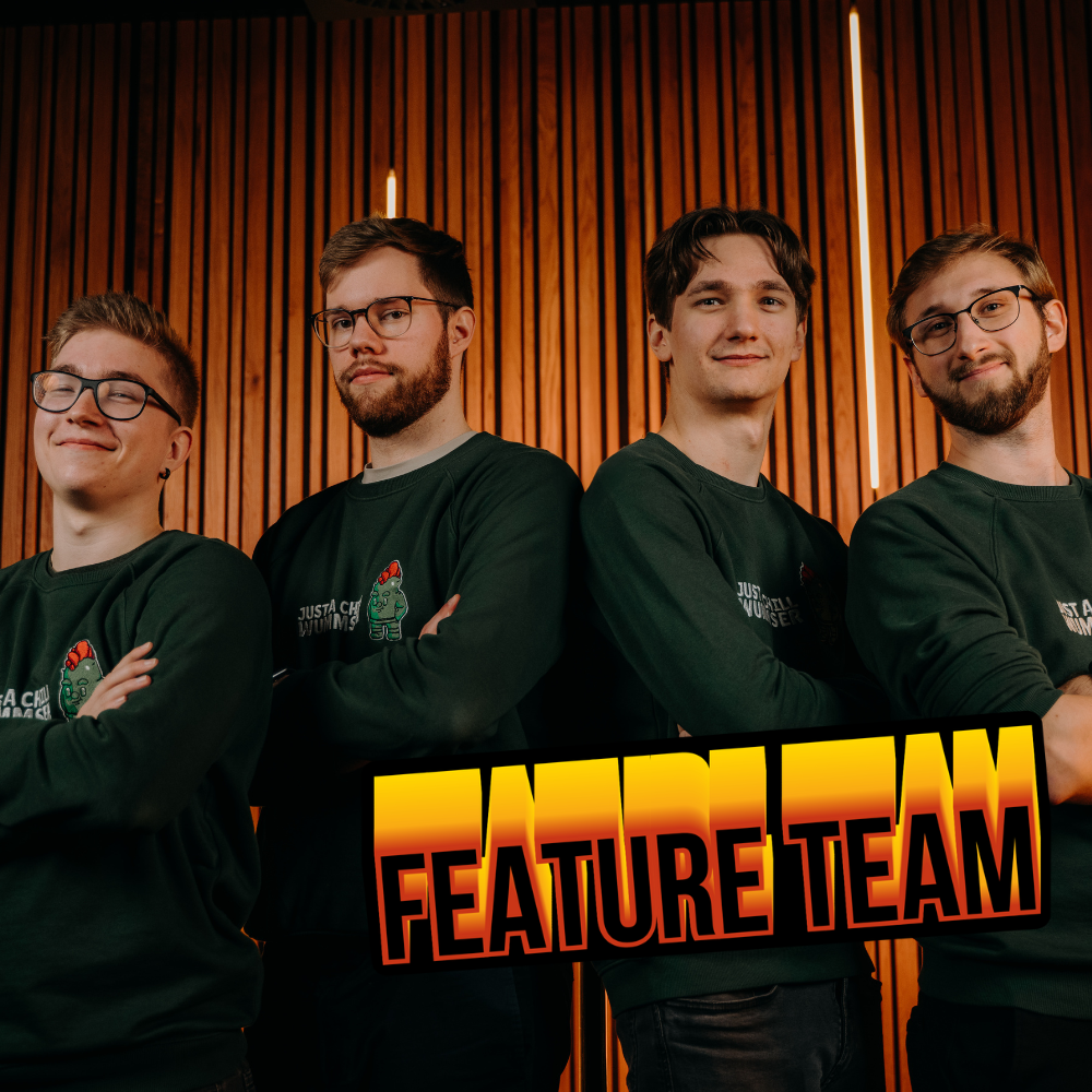 Start-up – JoyJab Games_Featureteam_1000x1000 Vier junge Männer stehen vor der Kamera. Sie haben die Arme vor der Brust verschränkt und stehen leicht seitlich. Zudem ist die Aufschrift Feature Team auf dem Bild zu lesen.